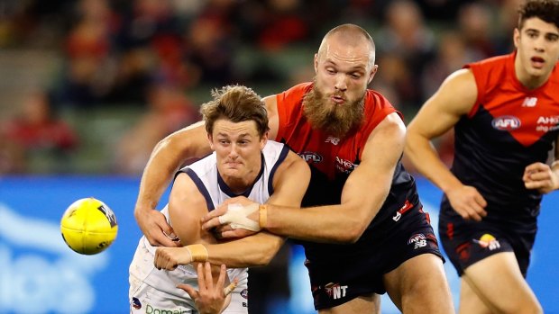 Big Demon Max Gawn tackles Matt Crouch, who has become an important contributor for the Crows.