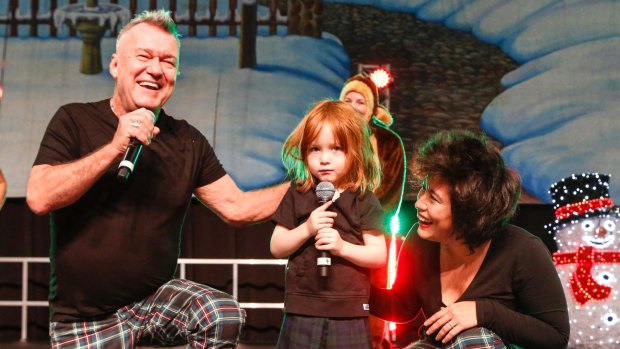 Jimmy Barnes, his wife Jane and grandson Dylan perform at the Variety Kids Xmas Party on Tuesday.