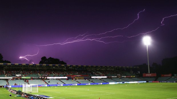Under lights: Lightning strikes delayed the start of play in the match between Western Sydney and Melbourne City.
