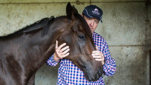Measuring stick: She Will Reign with trainer Gary Portelli at his Warwick Farm stables. 