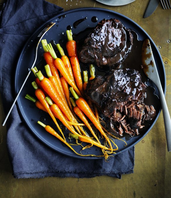 Braised beef cheeks with baby carrots.