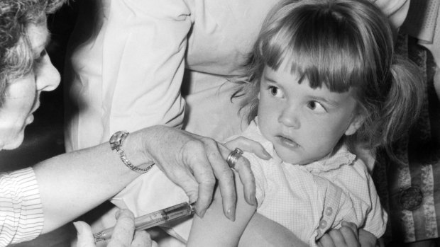 A little girl receives a polio vaccine at Broadmeadows Town Hall in 1968.