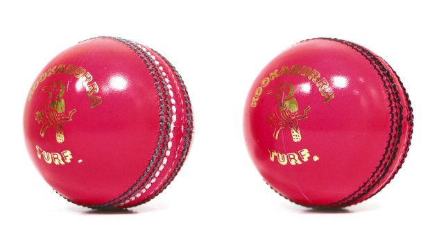 Old and new: the latest pink ball (right) has black stitching instead of green and white.