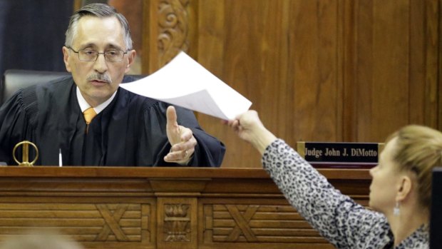 Milwaukee County Circuit Judge John DiMotto presides over court after the verdict was read.