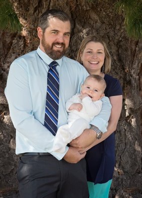Kate Henderson with her husband Cody and her son Augustus at his christening in April.