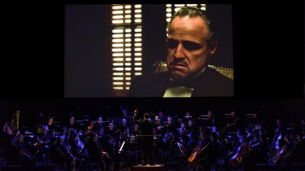 The Melbourne Symphony Orchestra performs The Godfather. Marlon Brando infamously mumbles along.