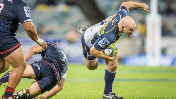 Hooker Stephen Moore of the ACT Brumbies stumbles in the slippery conditions.