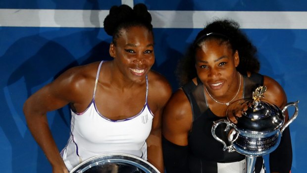 All smiles: Venus Williams and Serena Williams after the match.
