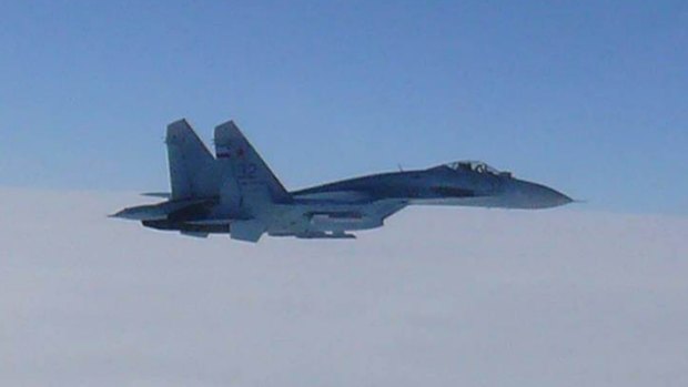 A Russian SU-27 flies over the sea near Japan last year.