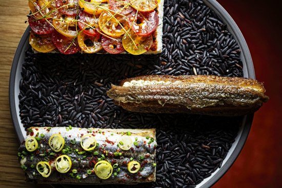 Pan tomate (left) and anchovy churro.