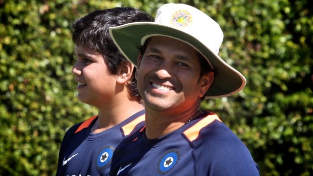 Growing up fast: Arjun Tendulkar, pictured with father Sachin in 2012.