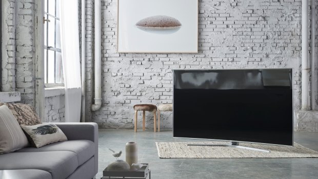 The Series 9 JS9500 fills a living room.