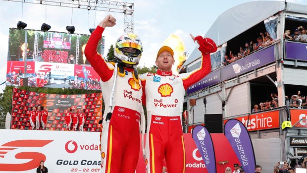 Revved up: Scott McLaughlin and co-driver Alexandre Premat celebrate winning race 22 of the Vodafone Gold Coast 600 on the Surfers Paradise street circuit.