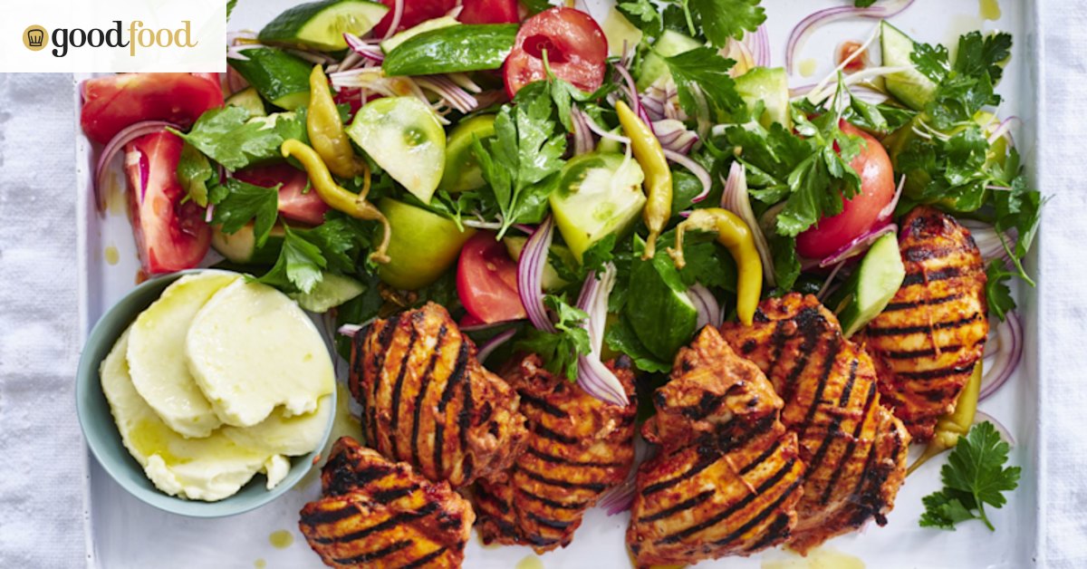 Grilled chicken with toum, and cucumber and tomato salad