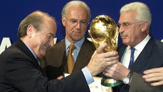 FIFA chief Sepp Blatter, left, in Zurich in July 2000 with (from left) Franz Beckenbauer and Fedor Radmann after FIFA announced that Germany would host the 2006 World Cup.