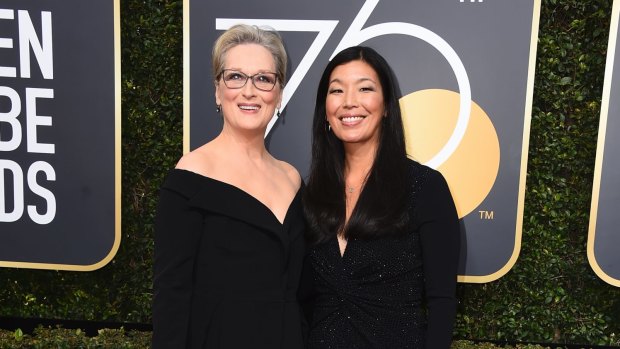 Meryl Streep, left, and Ai-jen Poo arrive at the 75th annual Golden Globe Awards at the Beverly Hilton Hotel on Sunday, Jan. 7, 2018, in Beverly Hills, California.