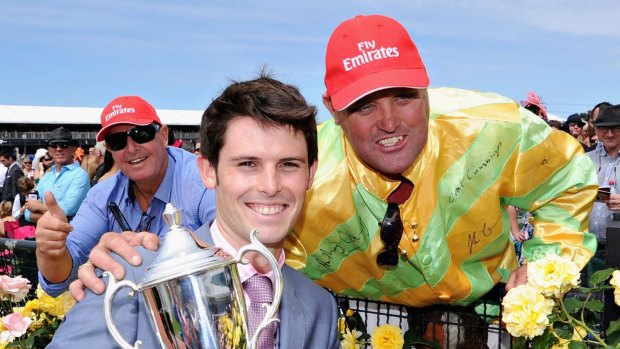 Young gun: James Cummings poses with the trophy after Zarzali won at Flemington on Melbourne Cup Day.