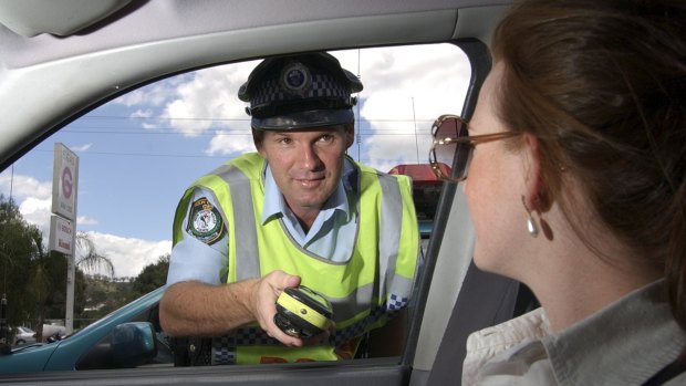 Senior Constable David Rixon, photographed on duty during highway patrol in 2007, was shot and killed in Tamworth in 2012.