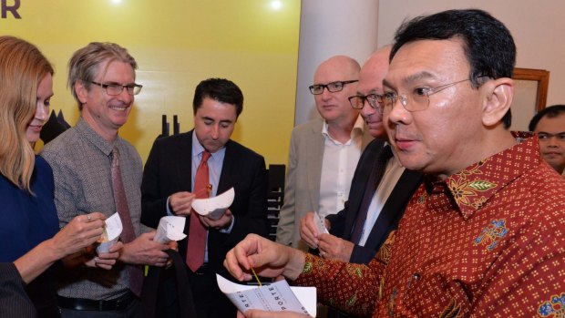 Australian journalists and the country's ambassador to Indonesia, Paul Grigson (right, in beige jacket), with Jakarta governor Basuki Tjahaja Purnama (right), known by his nickname, Ahok, at Jakarta city hall in March. 