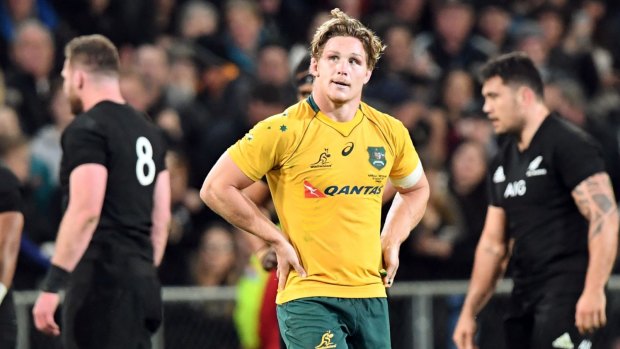So close: Michael Hooper looks to the scoreboard in disbelief after another loss to the All Blacks in Dunedin in August.