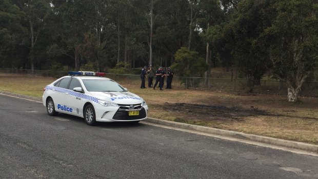 Police are searching an area in Sydney's south west after finding the burnt out car used in a fatal shooting this week. 