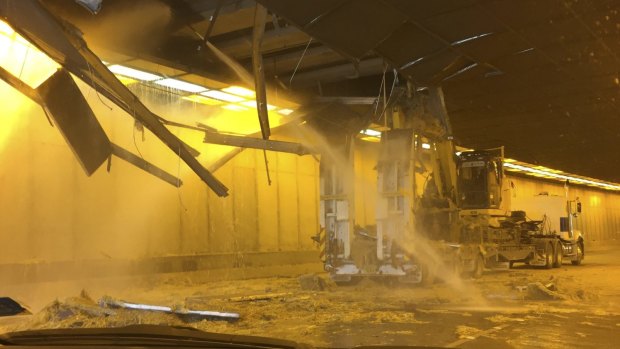 The truck and excavator in the Parkes Way tunnel very shortly after the accident. 