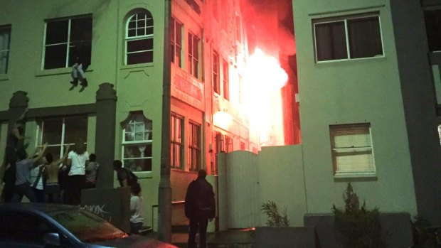 The woman sitting on her Bondi apartment windowsill as fire raged. 