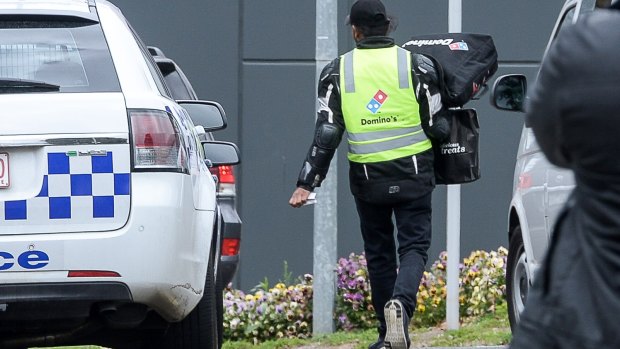  A Domino's Pizza deliveryman delivers an order to the centre on Monday aternoon.