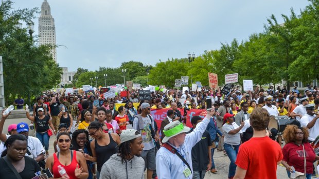 Protesters march to the state Capitol in Baton Rouge, Louisiana, on Sunday.