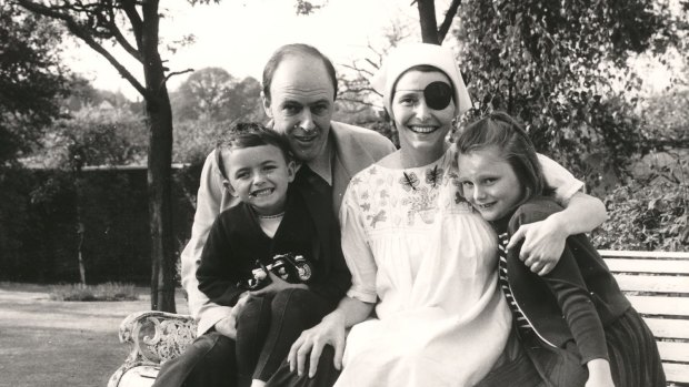 Author Roald Dahl with his wife, actress Patricia Neal, and their children, Theo and Tessa, in their garden at Great Missenden in 1965.
