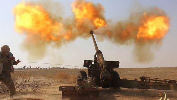 An Islamic State militant fires artillery against Syrian government forces in Hama city, Syria, in a photo posted on a militants' website last month.