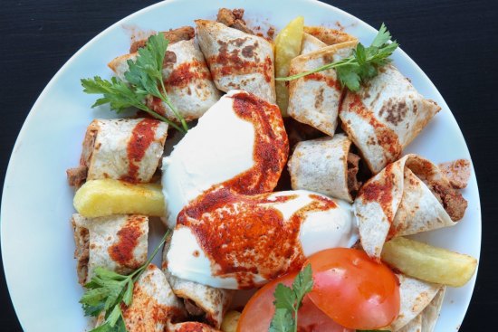 Beyti tantuni, wrapped in think pastry-like bread.