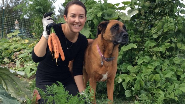Felicity Buckle and Macey with just harvested carrots. 