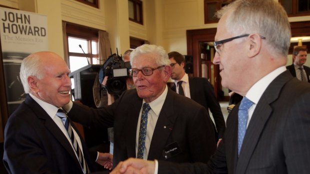 Former Menzies minister Tom Hughes (centre) with former Liberal prime minister John Howard and his son-in-law, Malcolm Turnbull. 