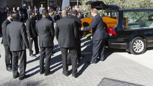 Myruan Sukumaran's coffin arrives at the church ahead of his funeral.