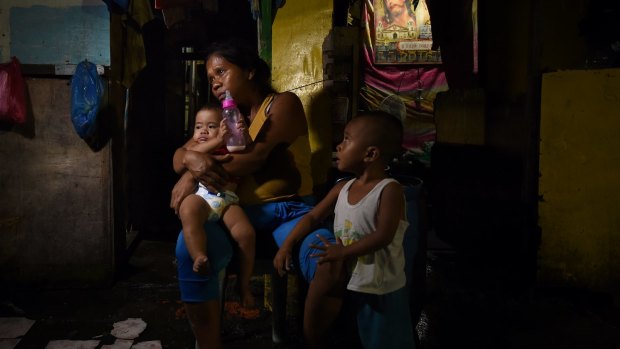 Seven month pregnant Ruth-Jane Sombrio with her children. Her husband, a drug user, was shot dead in front of her, a casualty of President Duterte's deadly campaign. 