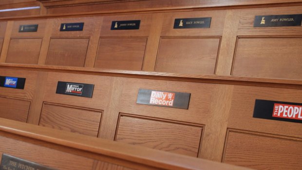 St Bride's pews are badged with the mastheads of some of Britain's best known publications.