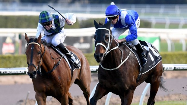 Turning point: Winx surges past Red Excitement in the Chelmsford Stakes. 