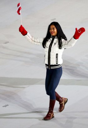 Mae marches in the Opening Ceremony in Sochi.