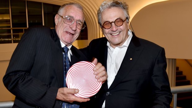 Stuntman Grant Page accepts his Screen NSW lifetime achievement award from director George Miller. 