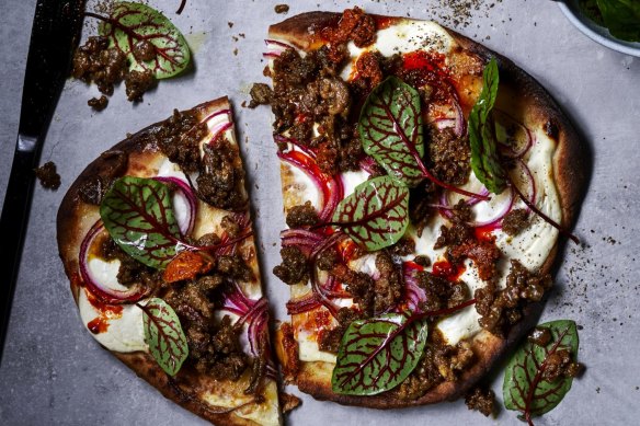 Spicy lamb naan pizza with mango pickle.
