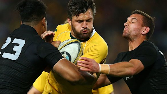 Going nowhere: Adam Ashley-Cooper runs into traffic in Sydney.