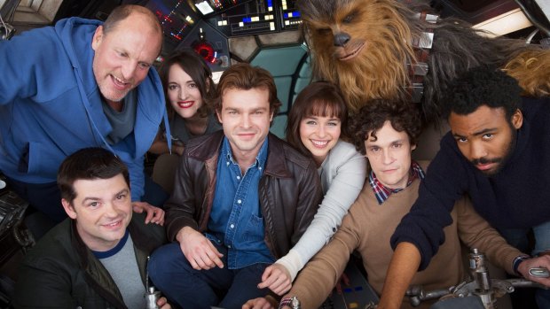 Christopher Miller (bottom left) and Phil Lord (second from the right) are no longer directing the next standalone Star Wars film. 