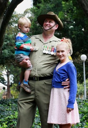 Sergeant Derek Isted with his children Andrew, 18 months, and Tiana, 10, in Hyde Park.