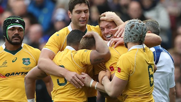 Reece Hodge celebrates after he scores Australia's first try of the game.