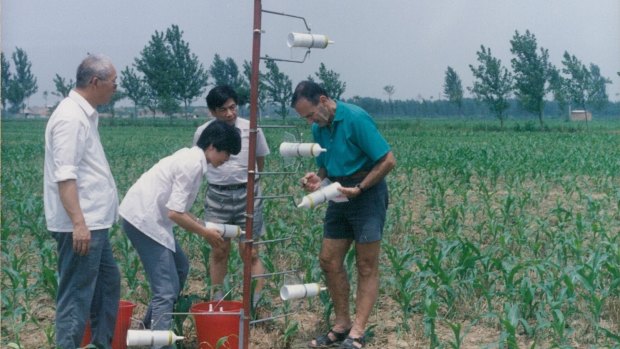 Agricultural scientist Dr John Freney, with his students in the field.