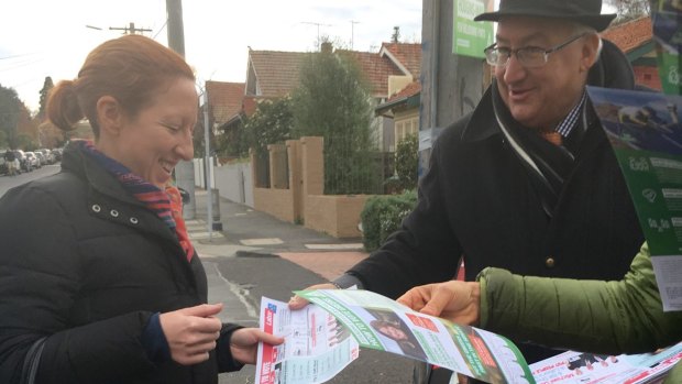 Michael Danby hands out his how to vote cards on election day.