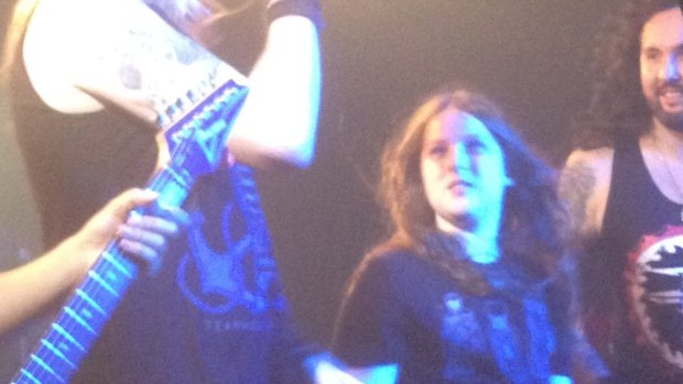 Canberra 12-year-old Callum McPhie on stage with the British heavy metal band DragonForce in Belconnen on Thursday night.