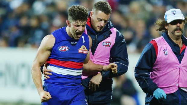 Tom Liberatore hobbles off with what Luke Beveridge hopes is no worse than a a bad sprain.