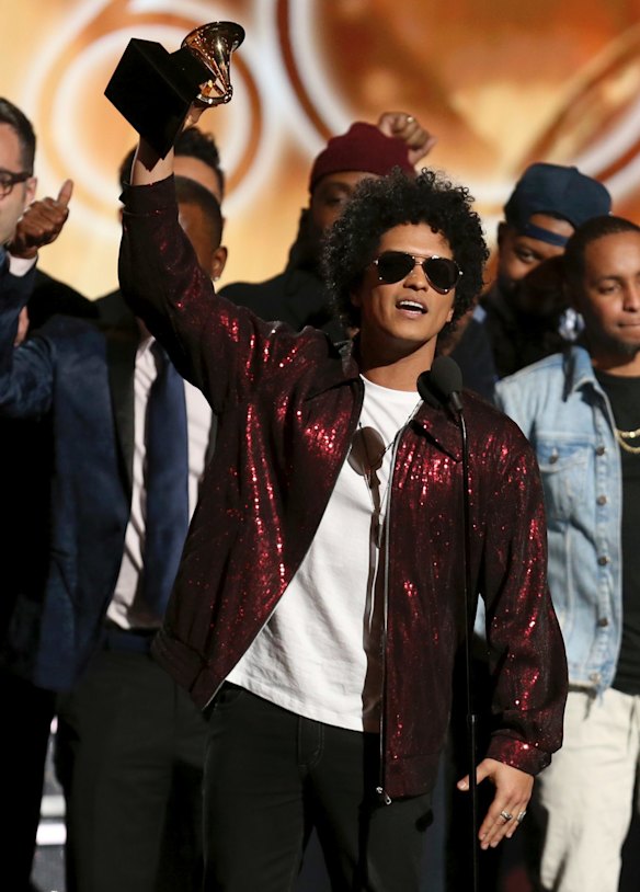 Bruno Mars accepts the award for album of the year for <i>24K Magic</i> at the 60th annual Grammy Awards.